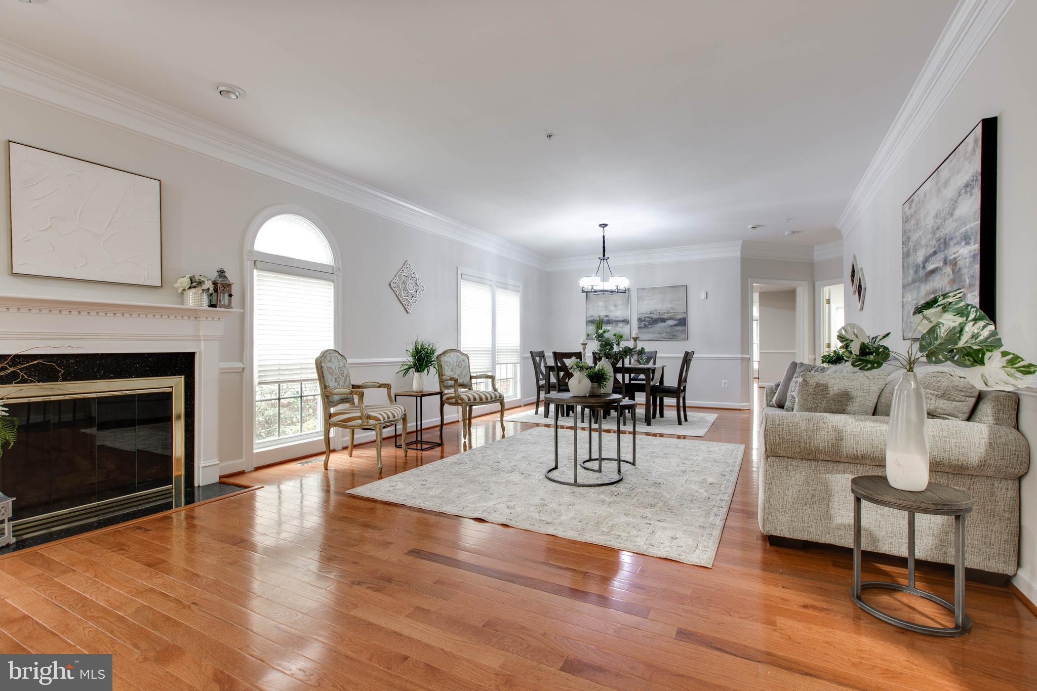 2610 Legends Way Ellicott City, MD 21042 - Photo 14 of 53 a living room with furniture a fireplace and a table