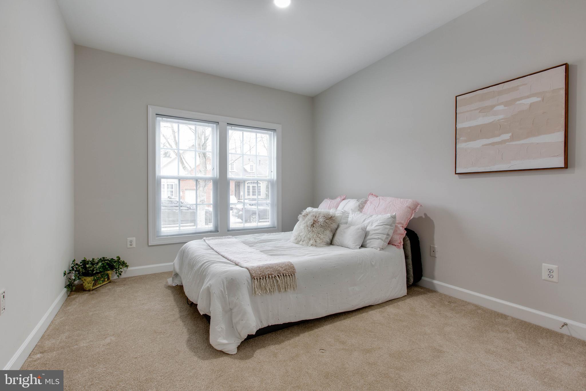 2610 Legends Way Ellicott City, MD 21042 - Photo 16 of 53 a bed sitting in a bedroom next to a window