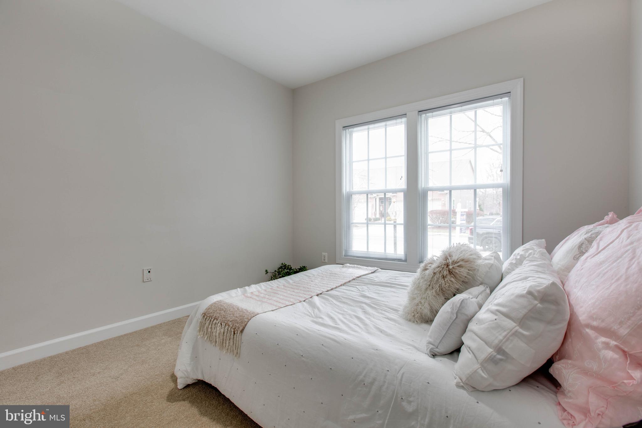 2610 Legends Way Ellicott City, MD 21042 - Photo 17 of 53 a bedroom with a bed and a window