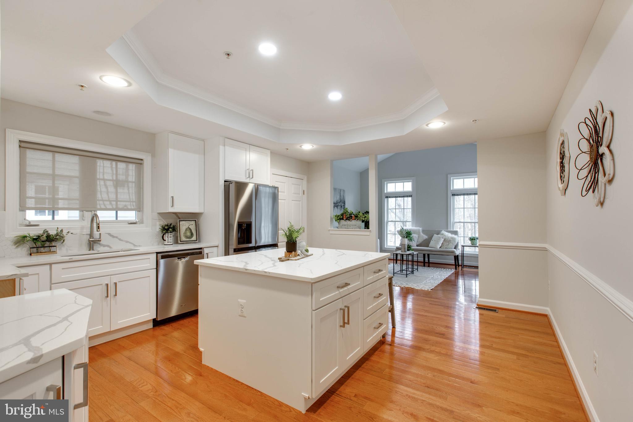 2610 Legends Way Ellicott City, MD 21042 - Photo 21 of 53 a kitchen that has a lot of white cabinets and stainless steel appliances