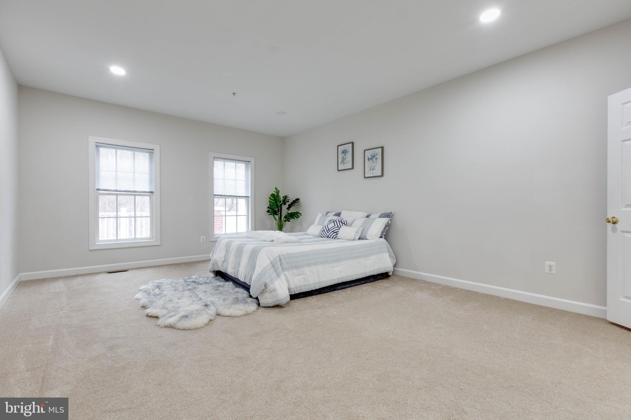 2610 Legends Way Ellicott City, MD 21042 - Photo 29 of 53 a spacious bedroom with a bed and a window