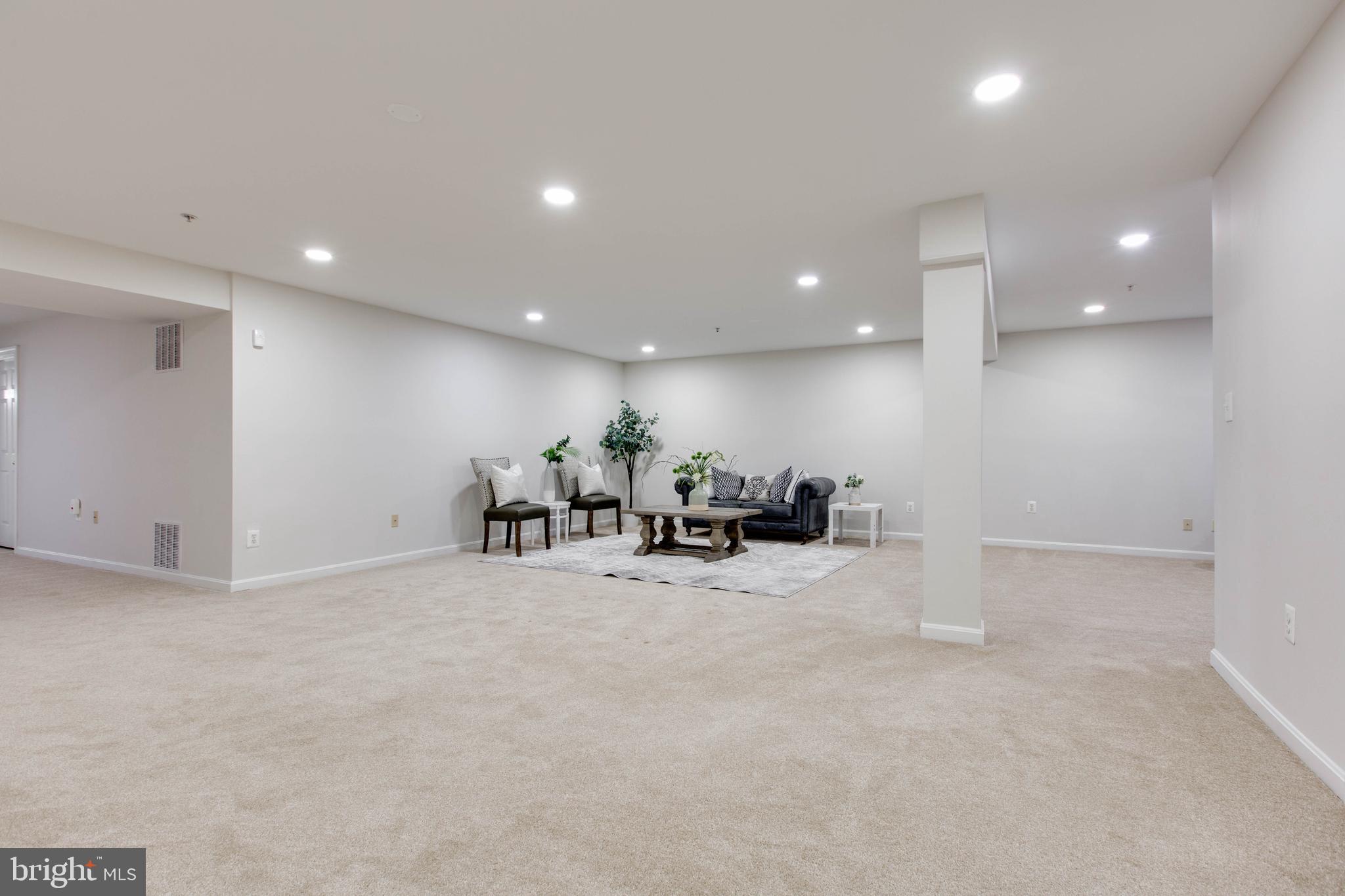 2610 Legends Way Ellicott City, MD 21042 - Photo 39 of 53 a view of a room with gym equipment and a chandelier