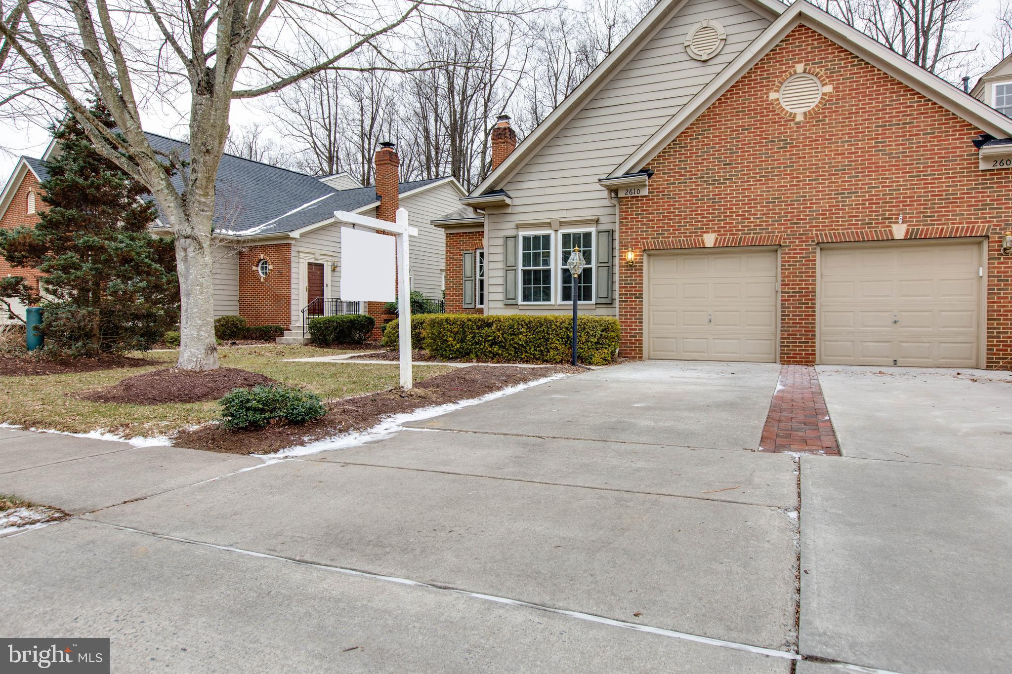 2610 Legends Way Ellicott City, MD 21042 - Photo 4 of 53 a front view of a house with a yard and garage