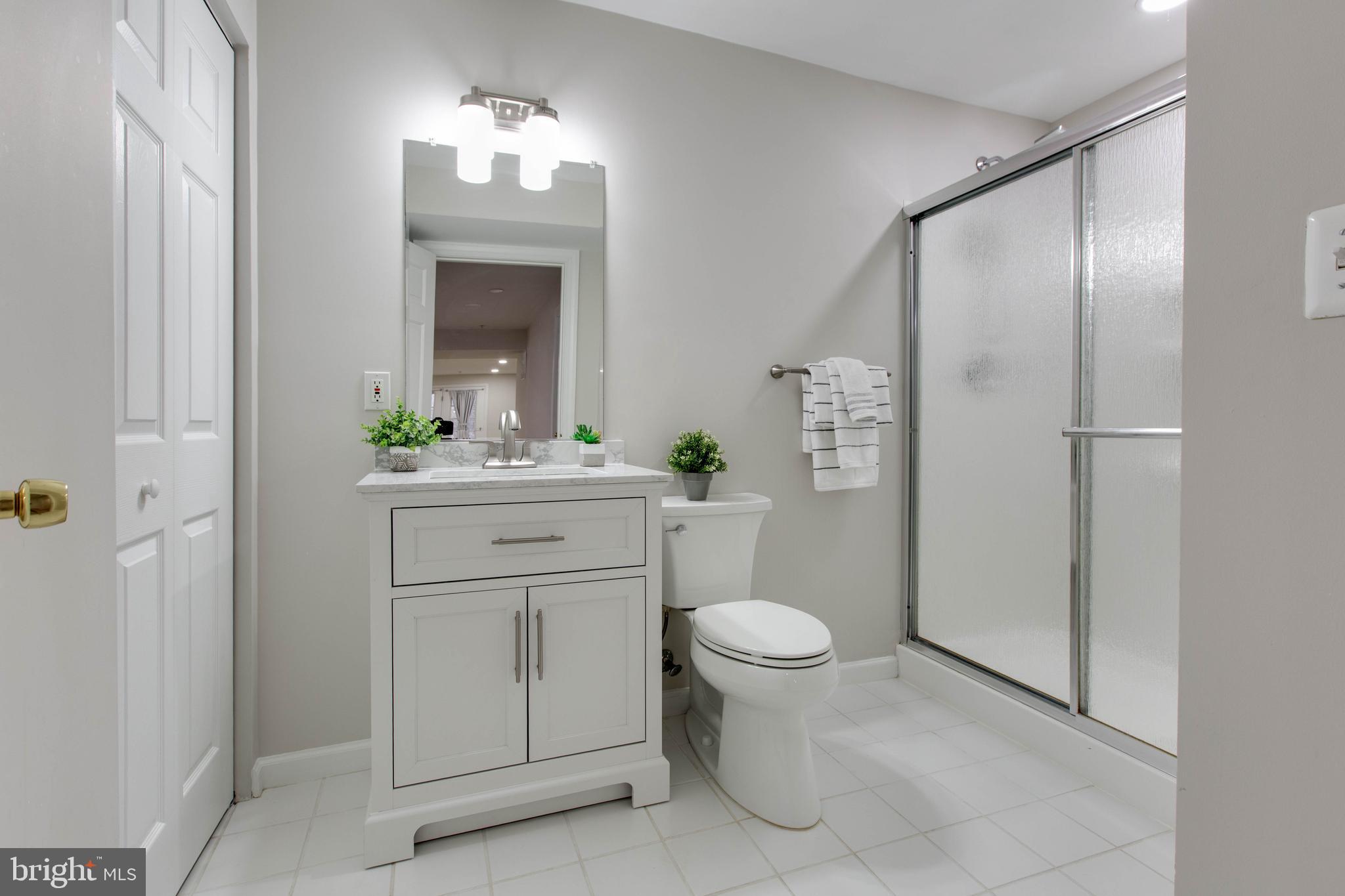 2610 Legends Way Ellicott City, MD 21042 - Photo 44 of 53 a bathroom with a sink toilet and mirror