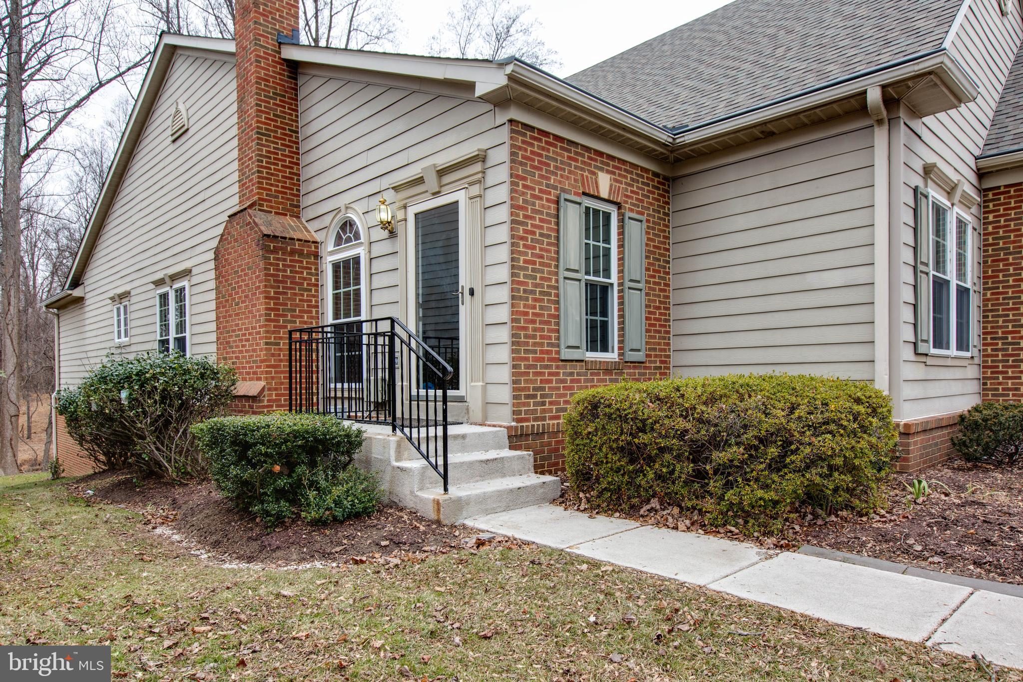 2610 Legends Way Ellicott City, MD 21042 - Photo 5 of 53 a front view of a house with garden
