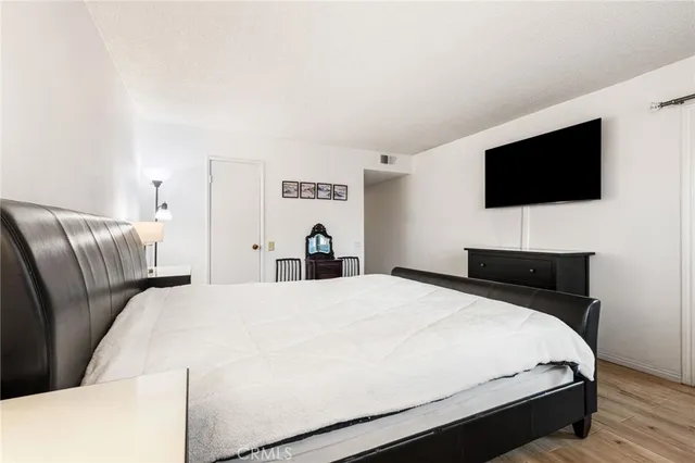 a view of a room with wooden floor and windows