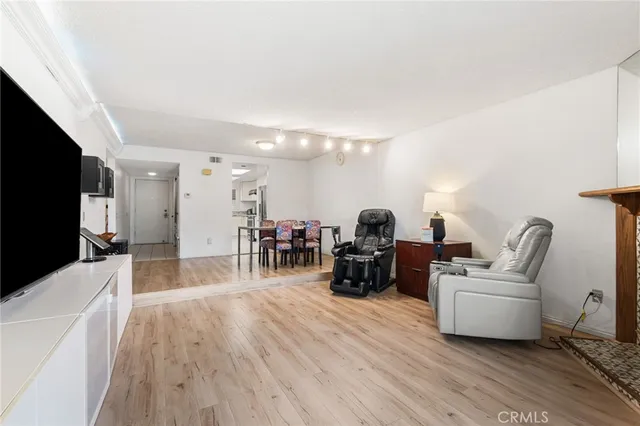 a kitchen with stainless steel appliances a refrigerator sink and cabinets