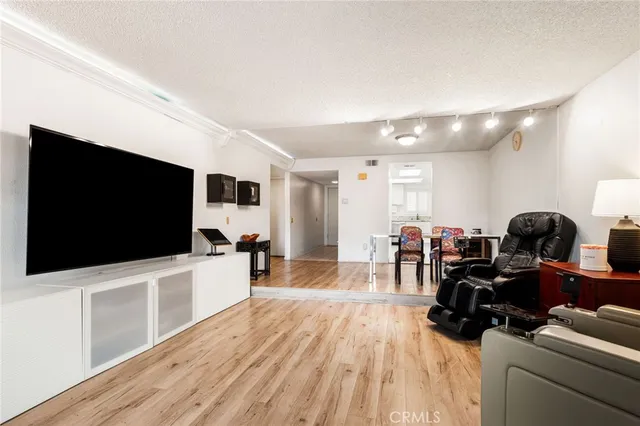 a kitchen with stainless steel appliances granite countertop a stove a refrigerator and a granite counter tops