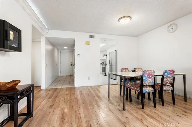 a kitchen with granite countertop stainless steel appliances a sink stove and cabinets