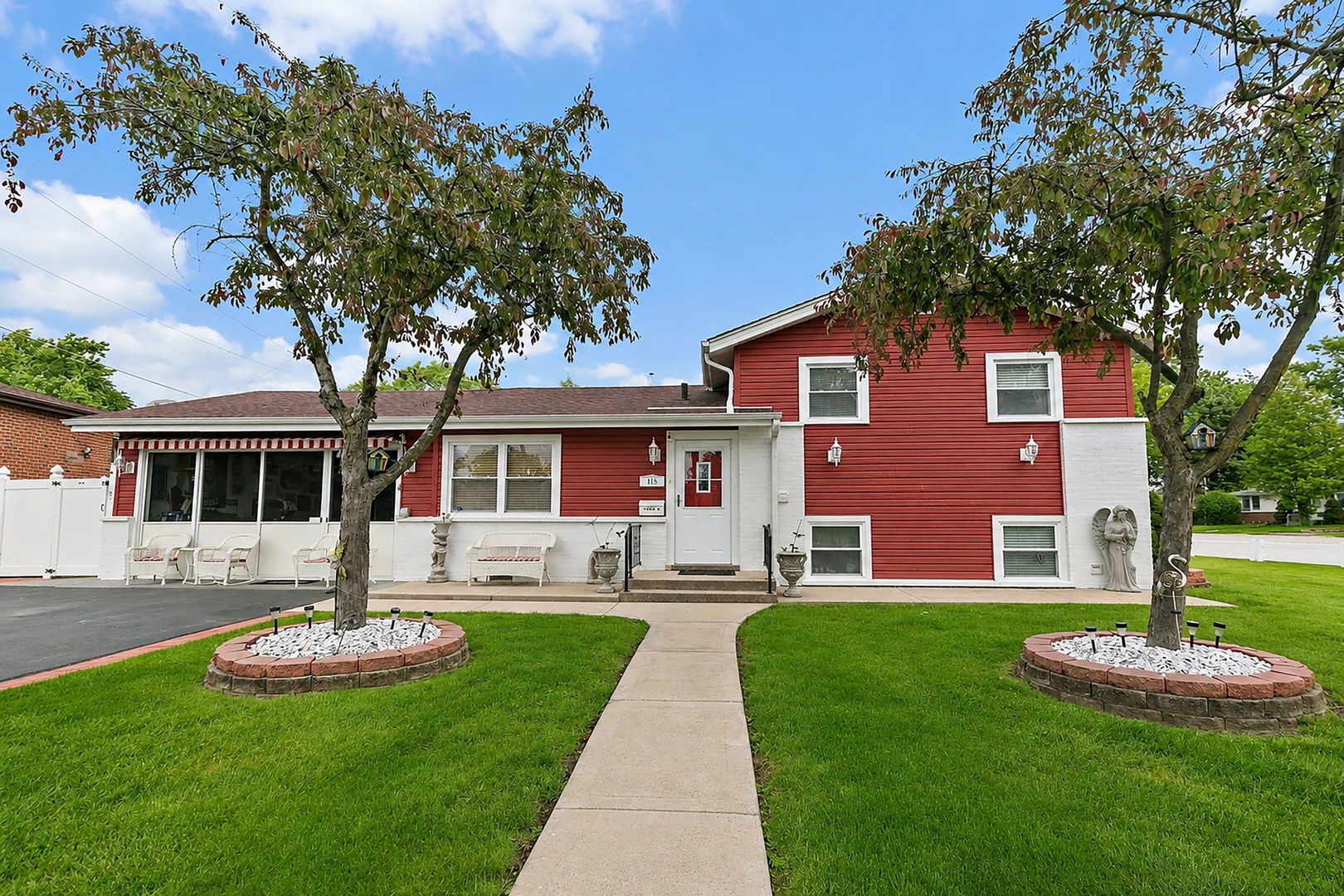 115 Rose Avenue Addison, IL 60101 - Photo 1 of 28 a front view of house with yard and green space