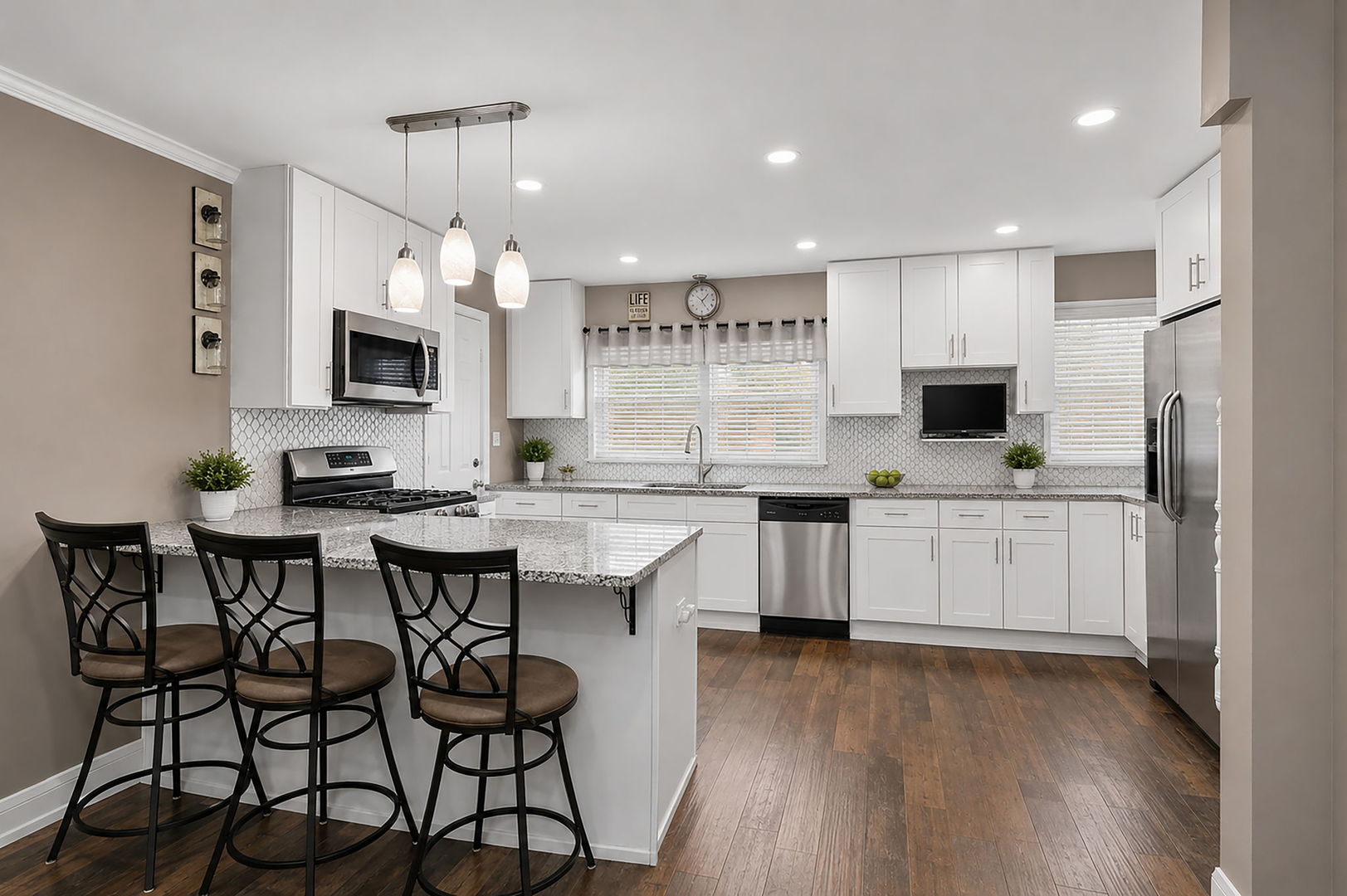 115 Rose Avenue Addison, IL 60101 - Photo 2 of 28 a kitchen with white cabinets and appliances