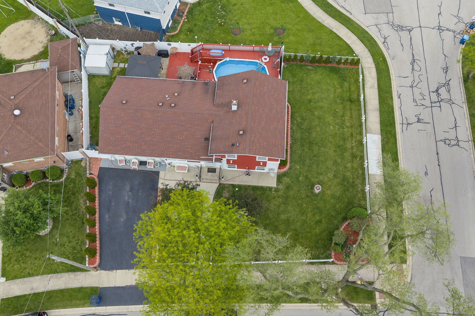115 Rose Avenue Addison, IL 60101 - Photo 24 of 28 an aerial view of a house with a yard and swimming pool