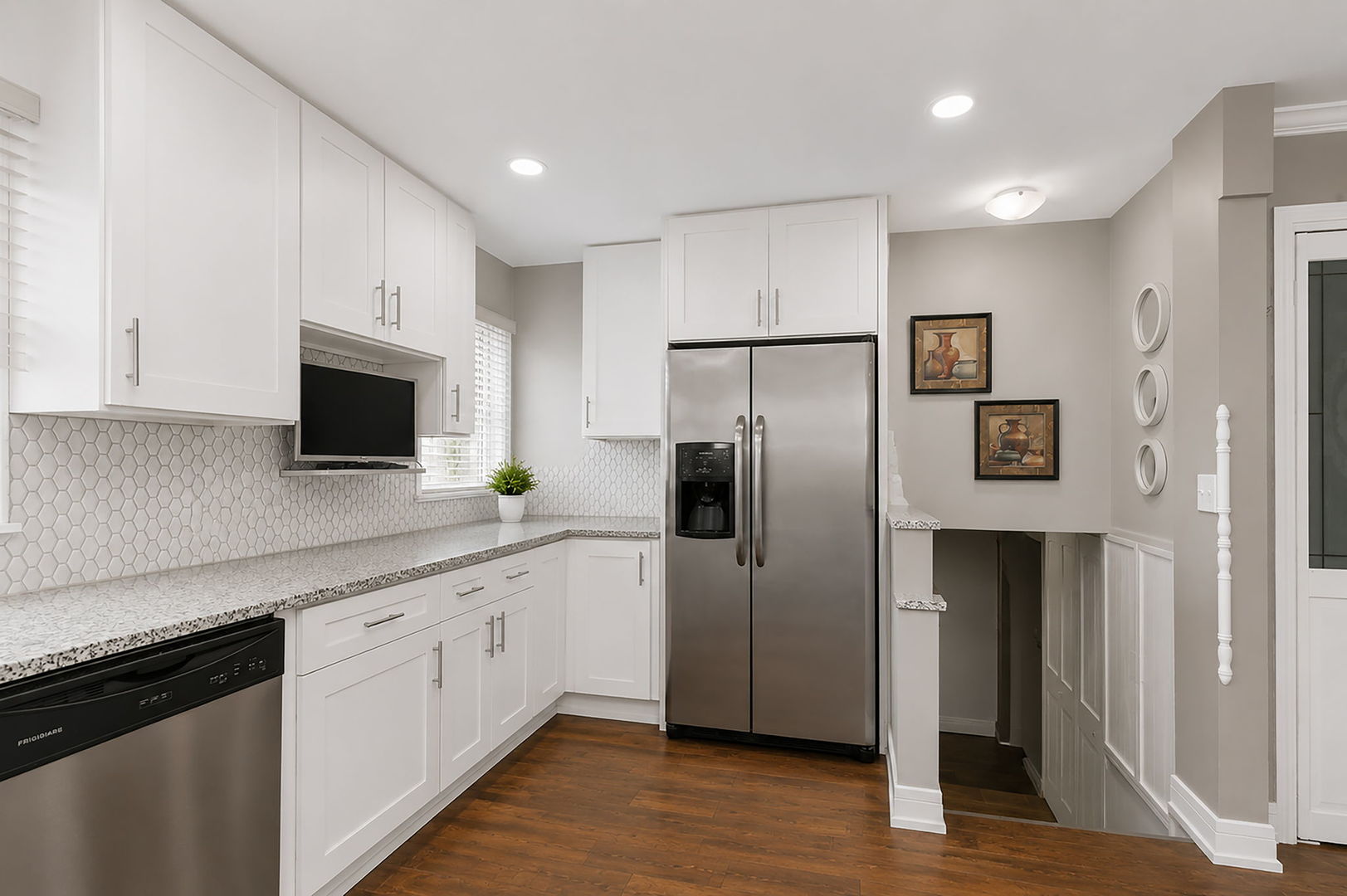 115 Rose Avenue Addison, IL 60101 - Photo 5 of 28 a kitchen with stainless steel appliances a refrigerator sink and microwave