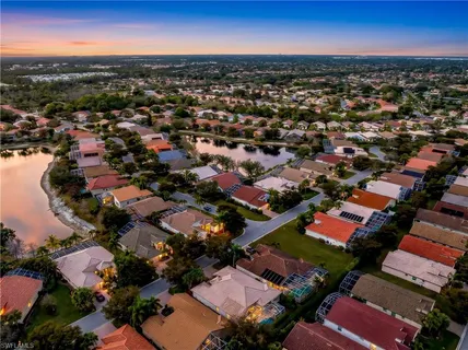 a view of a lake with a house in the background