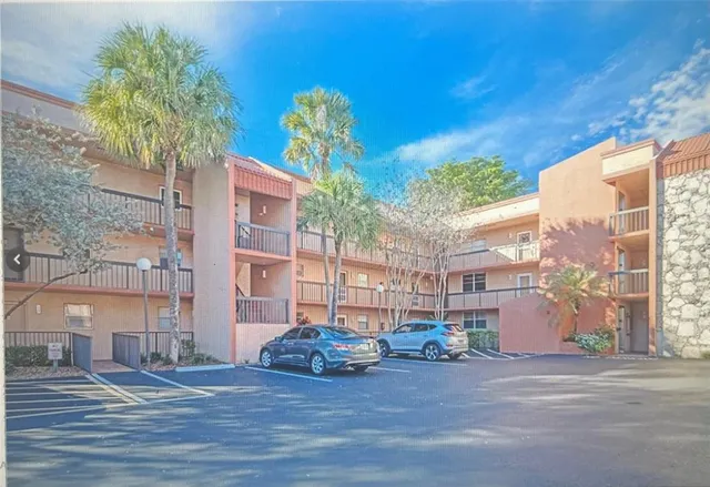 a view of a street with a building in the background
