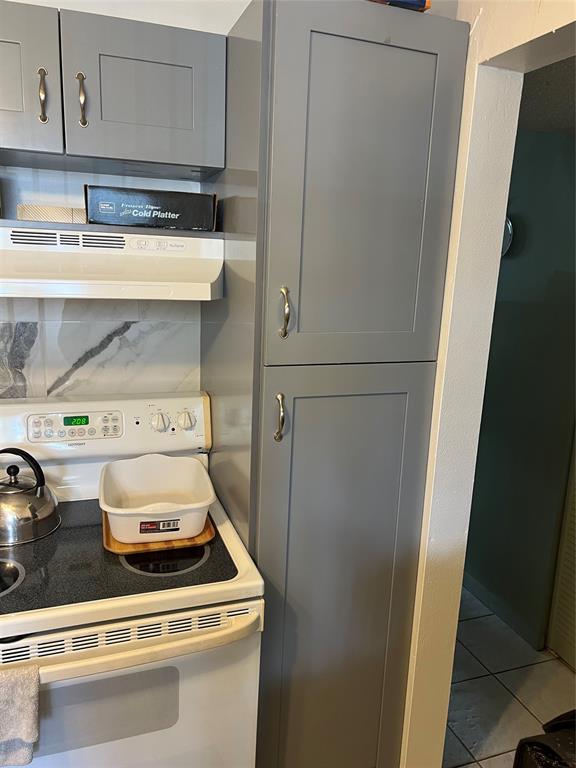 3140 Holiday Springs Boulevard, Unit 109 Margate, FL 33063 - Photo 11 of 26 a stove top oven sitting inside of a kitchen