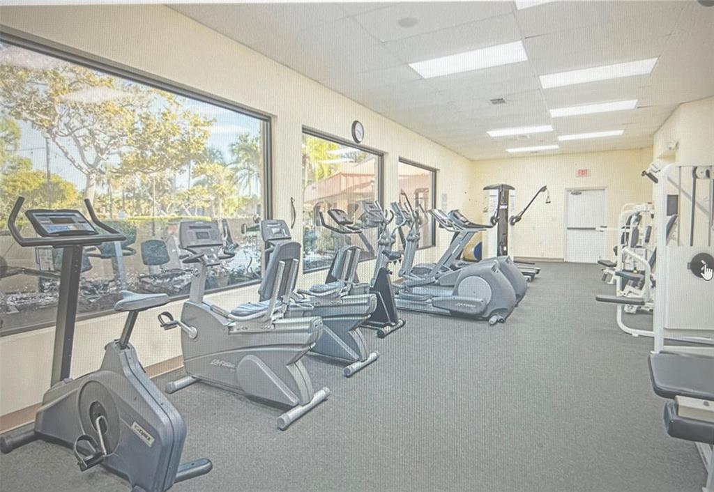 3140 Holiday Springs Boulevard, Unit 109 Margate, FL 33063 - Photo 20 of 26 a view of a room with gym equipment