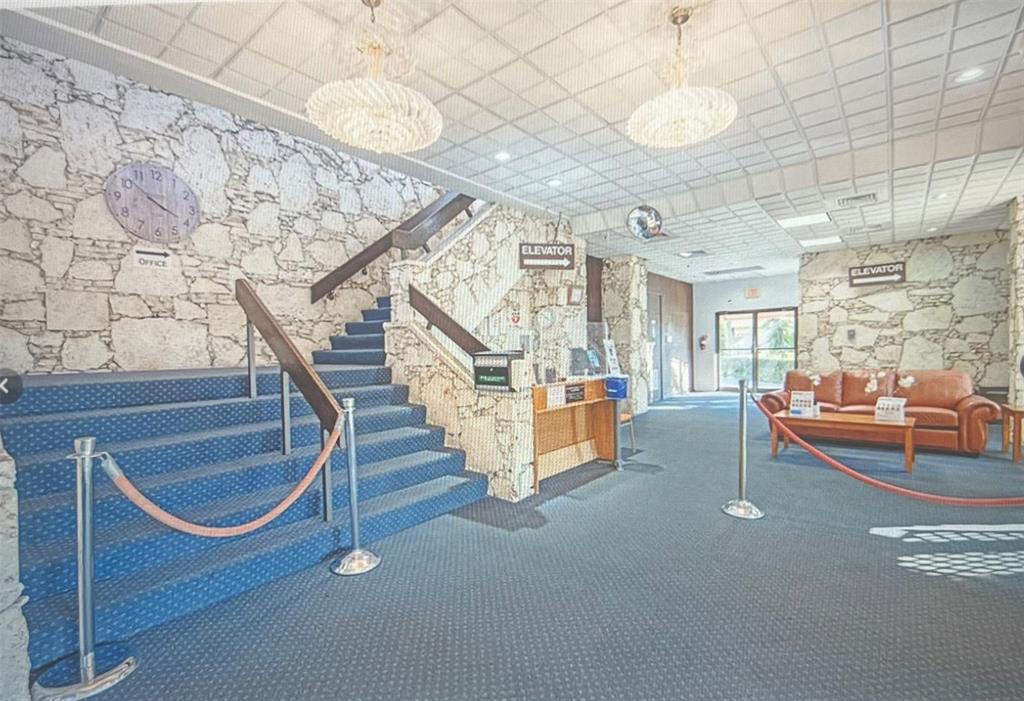 3140 Holiday Springs Boulevard, Unit 109 Margate, FL 33063 - Photo 21 of 26 a view of entryway and hall with wooden floor