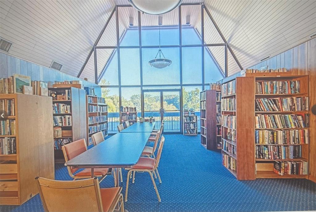 3140 Holiday Springs Boulevard, Unit 109 Margate, FL 33063 - Photo 23 of 26 a dining room with furniture window and wooden floor
