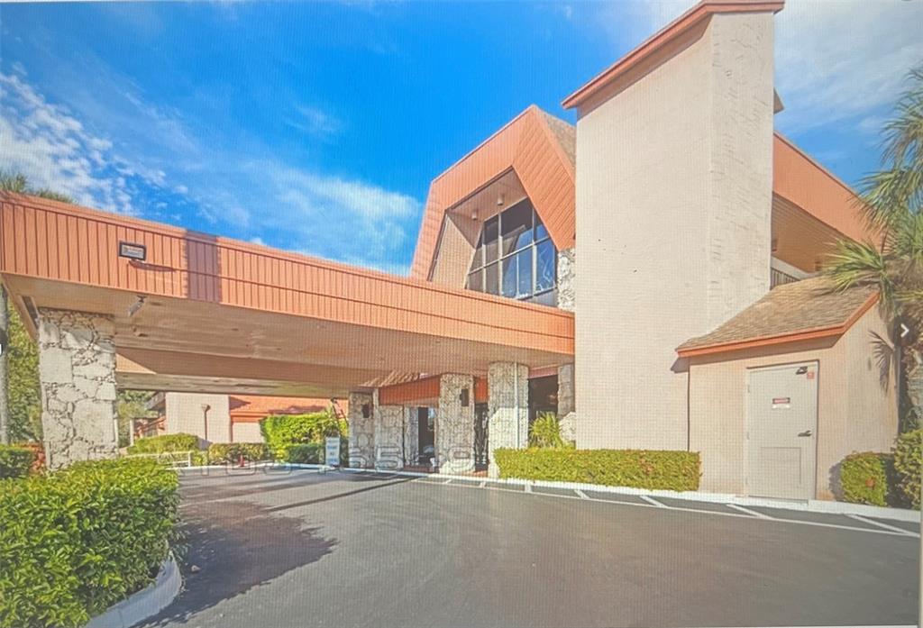 3140 Holiday Springs Boulevard, Unit 109 Margate, FL 33063 - Photo 24 of 26 a view of a house with a street