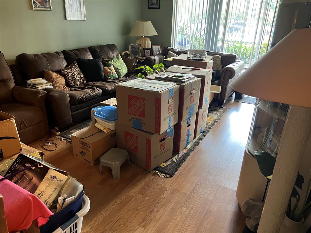 3140 Holiday Springs Boulevard, Unit 109 Margate, FL 33063 - Photo 3 of 26 a living room with furniture and a window