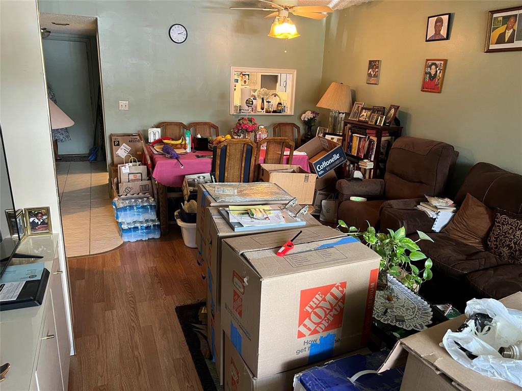 3140 Holiday Springs Boulevard, Unit 109 Margate, FL 33063 - Photo 4 of 26 a bed room with furniture and a flat screen tv