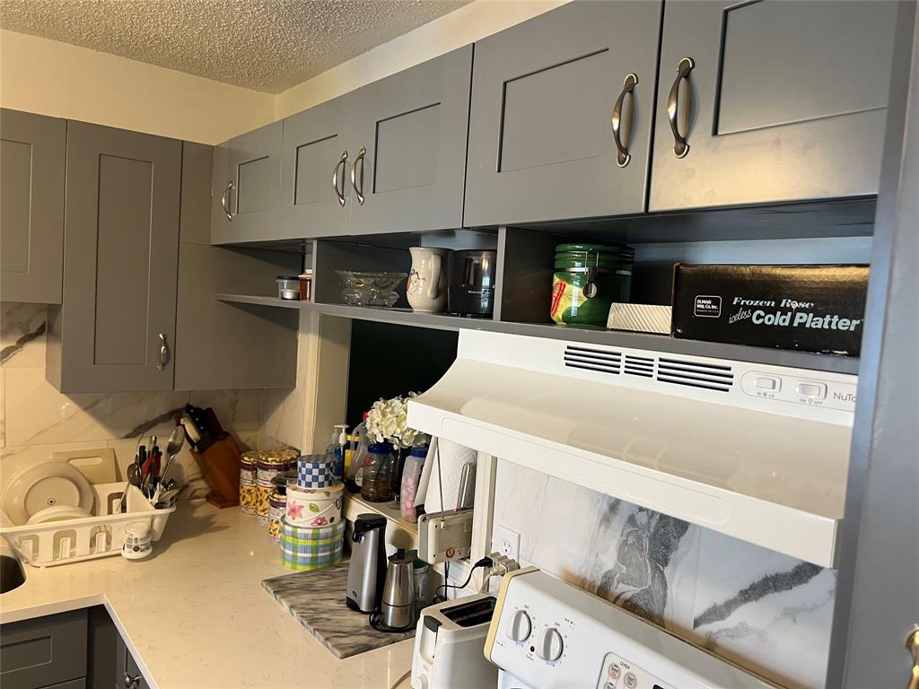 3140 Holiday Springs Boulevard, Unit 109 Margate, FL 33063 - Photo 9 of 26 a view of a kitchen with appliances and cabinets