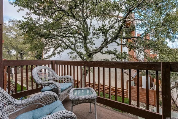 a balcony with wooden floor