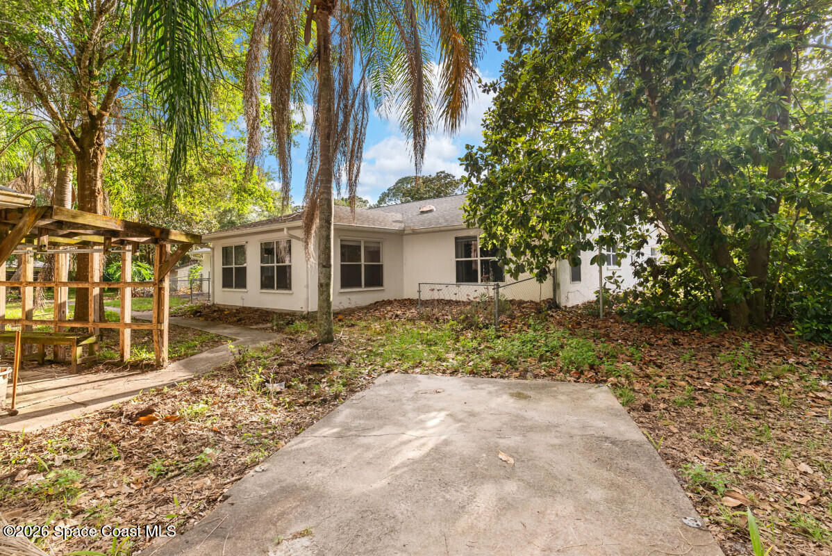 2493 Adamson Road Cocoa, FL 32926 - Photo 11 of 46 front view of a house with a yard