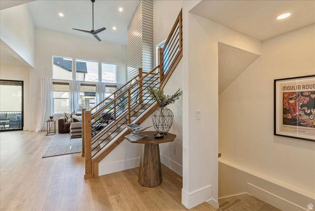 2458 West Aurora Avenue, Unit 287 Mapleton, UT 84664 - Photo 6 of 24 Staircase featuring recessed lighting, wood finished floors, a ceiling fan, and a high ceiling