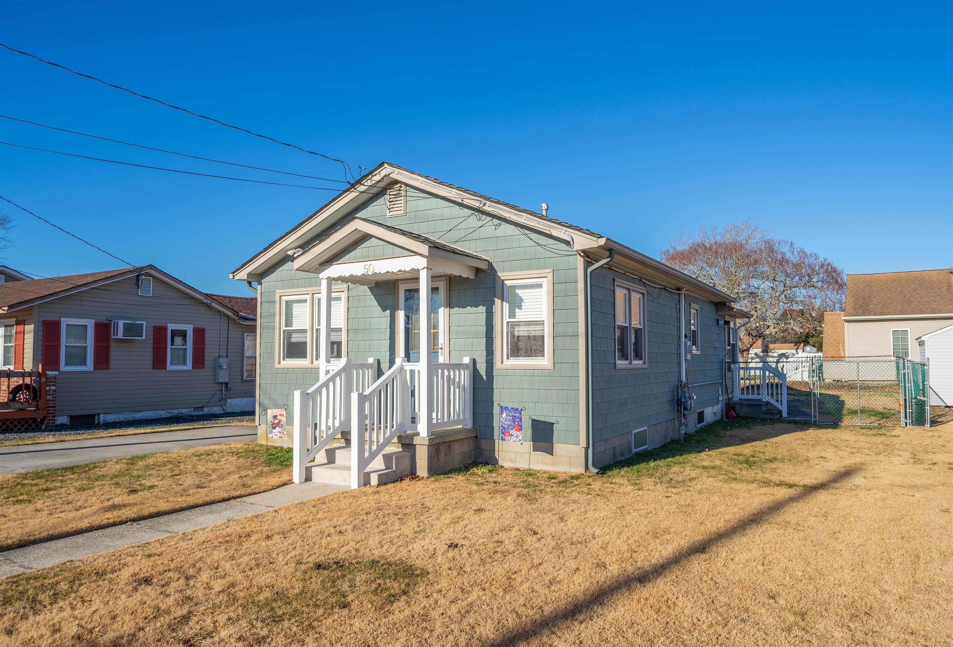 50 Vacation Villas, NJ 08251 - Photo 8 of 21 a front view of a house with a yard