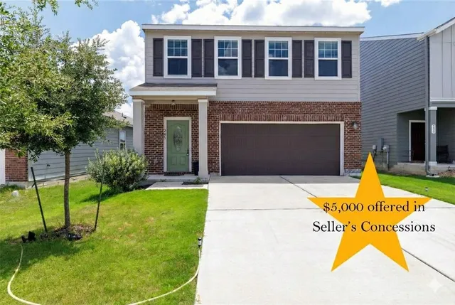 a view of a house with backyard