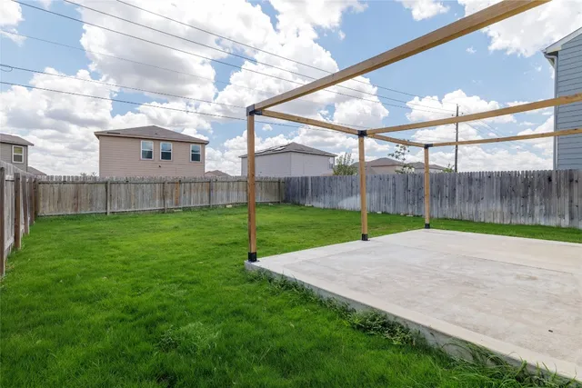 a view of a backyard with grass