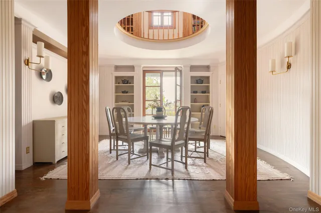 a view of a hallway with furniture and entryway
