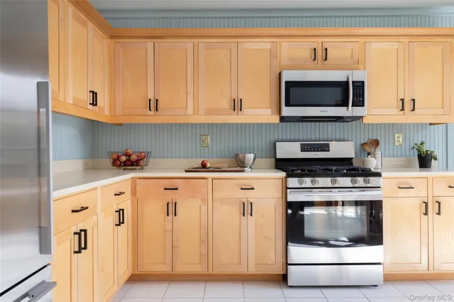 a living room with furniture and large windows