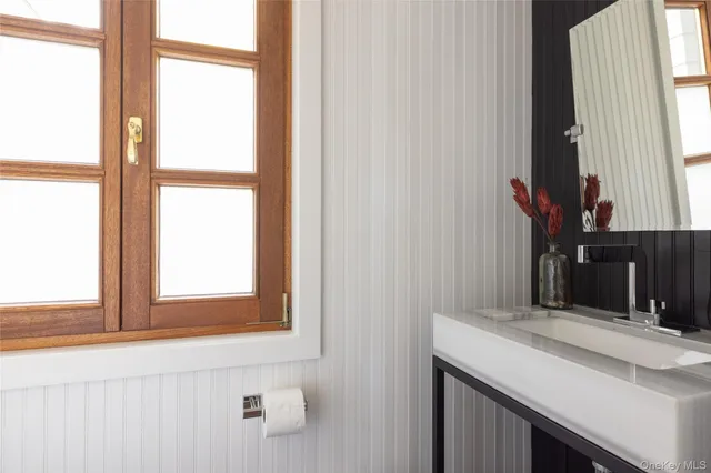 a living room with a large window and a couch