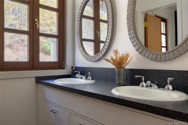 a view of a house with a yard and furniture