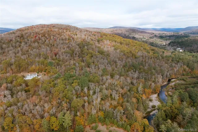 an aerial view of houses with yard
