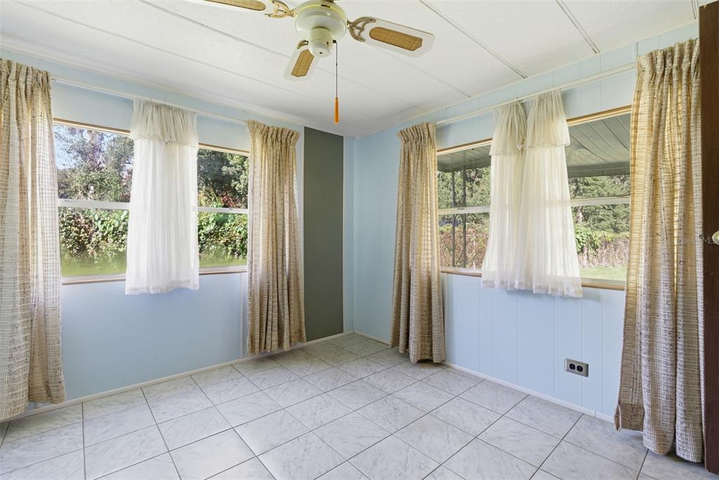 6147 Ridgewood Drive Zephyrhills, FL 33542 - Photo 13 of 21 a view of an empty room with a window