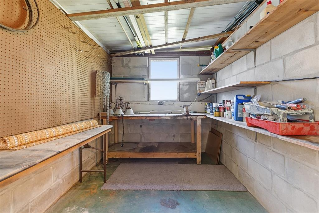 6147 Ridgewood Drive Zephyrhills, FL 33542 - Photo 20 of 21 a utility room with cabinets and washer