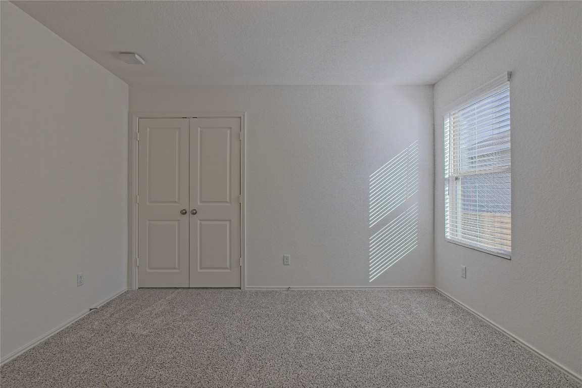 505 Greatest Gift Way Jarrell, TX 76537 - Photo 23 of 30 an empty room with windows