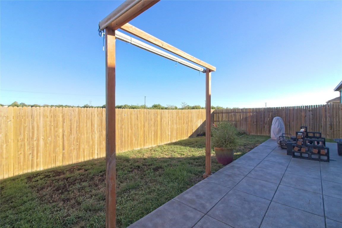 505 Greatest Gift Way Jarrell, TX 76537 - Photo 27 of 30 a backyard view with a garden and seating space