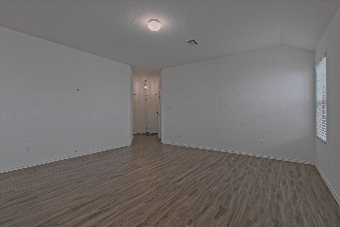 505 Greatest Gift Way Jarrell, TX 76537 - Photo 5 of 30 a view of an empty room with wooden floor
