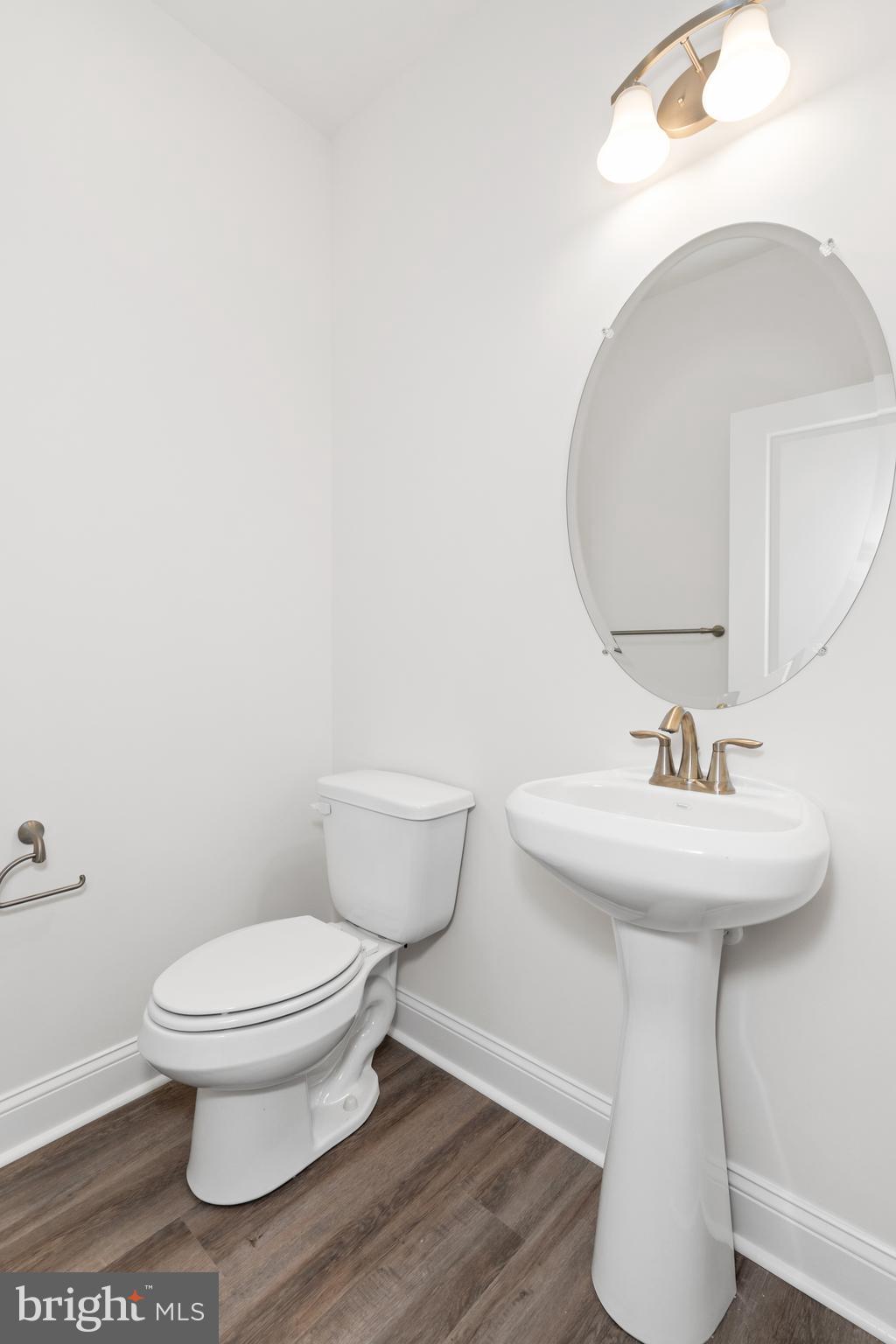 872 Mapleton Avenue Middletown, DE 19709 - Photo 12 of 23 a bathroom with a toilet sink and mirror