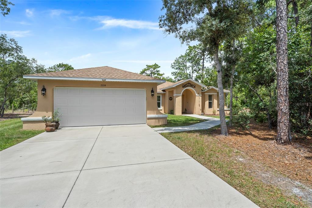 7339 Mandrake Road Weeki Wachee, FL 34613 - Photo 1 of 1 a house view with a outdoor space