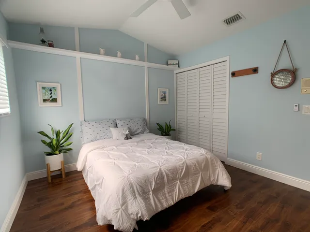 a bedroom with a bed and a table in it