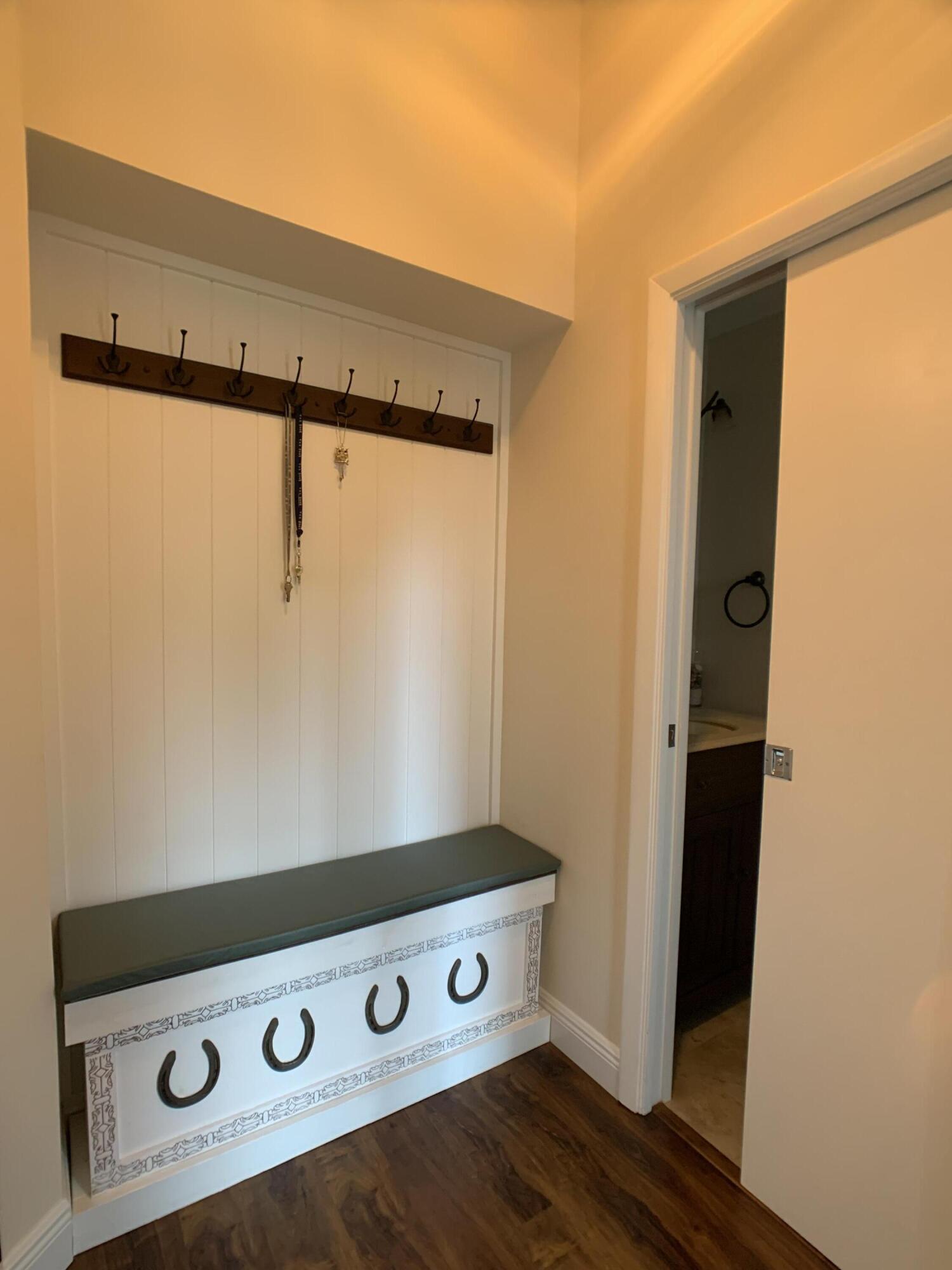 10465 Mateo Court Boca Raton, FL 33498 - Photo 34 of 36 a view of an empty room with wooden floor