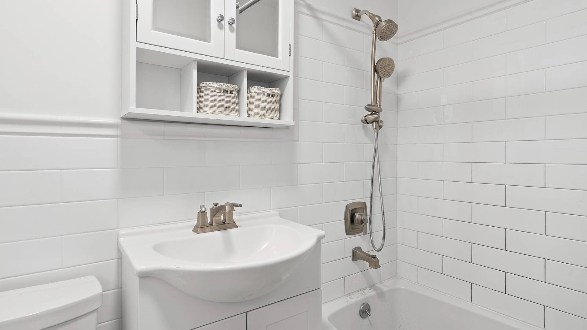 28 Pine Tree Road Southampton, NY 11968 - Photo 11 of 14 a bathroom with a sink a toilet and shower