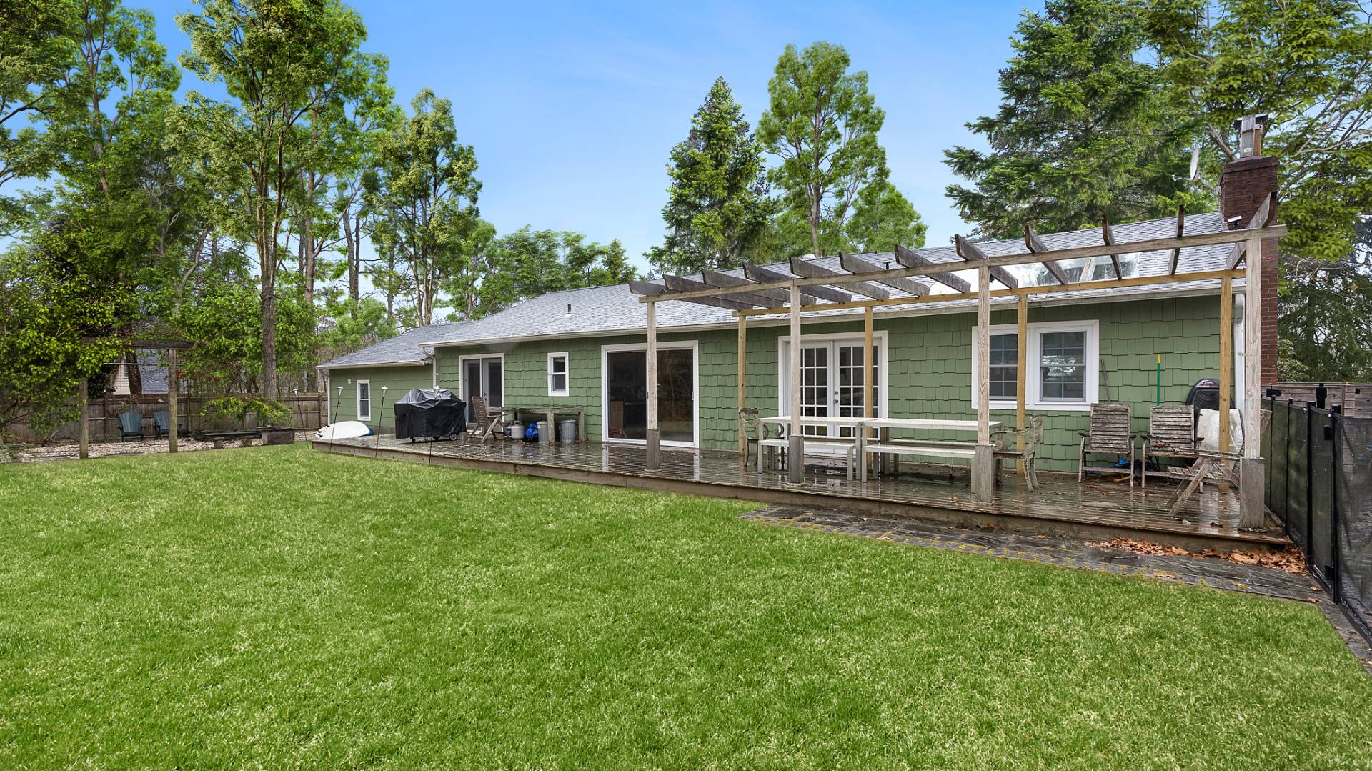 28 Pine Tree Road Southampton, NY 11968 - Photo 13 of 14 a view of a house with a yard and sitting area