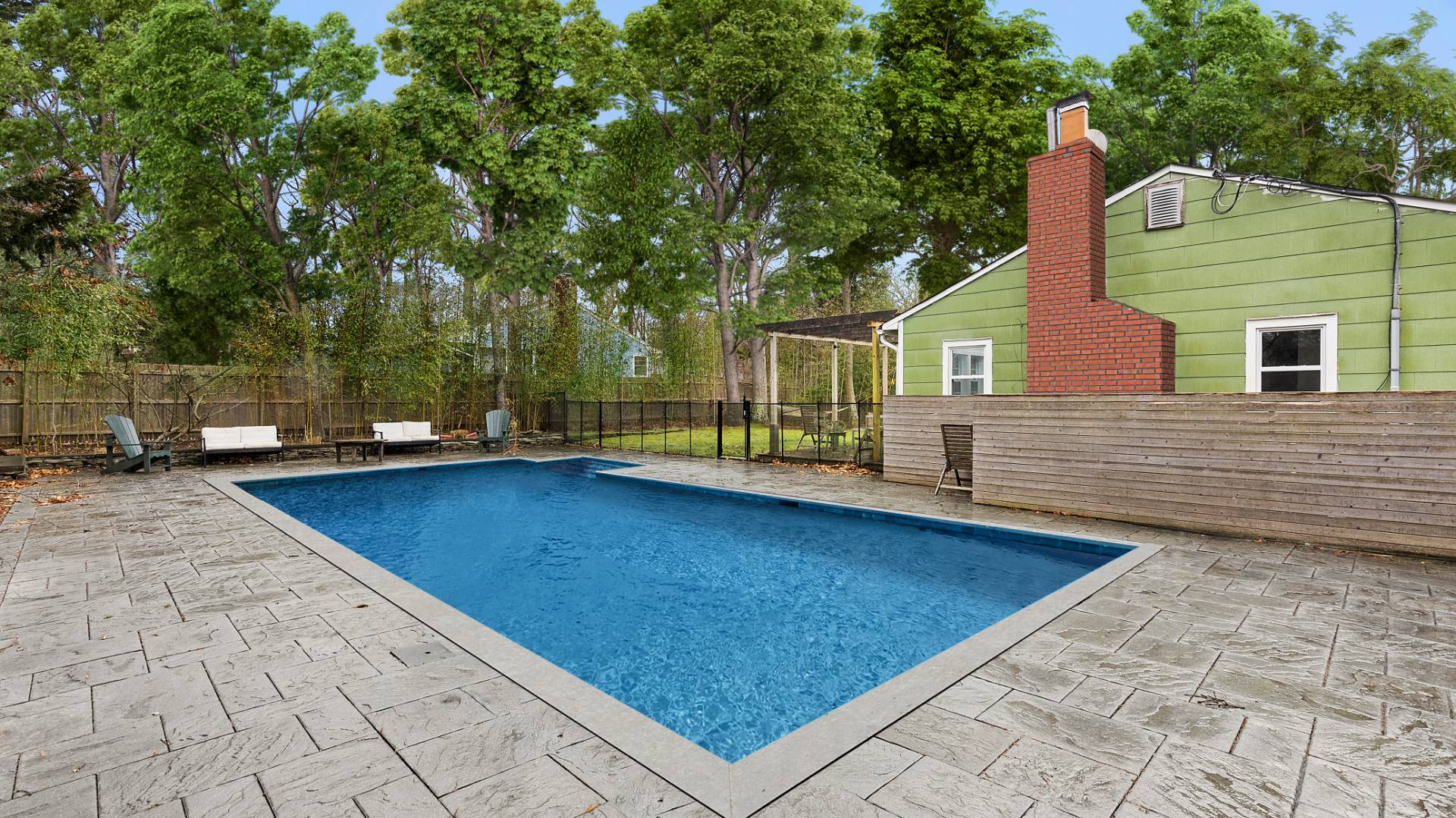 28 Pine Tree Road Southampton, NY 11968 - Photo 14 of 14 a view of a backyard with swimming pool